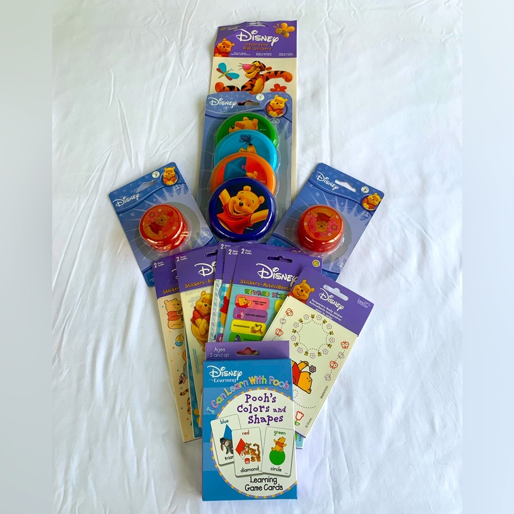 Vintage Winnie the Pooh toy/sticker bundle.